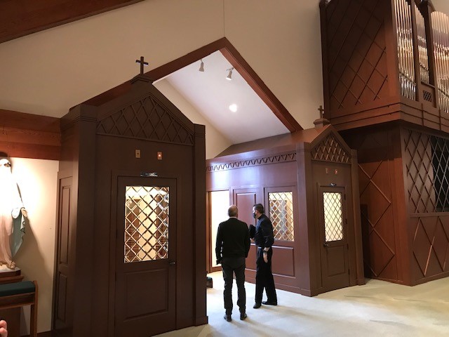 Two men near confessionals
